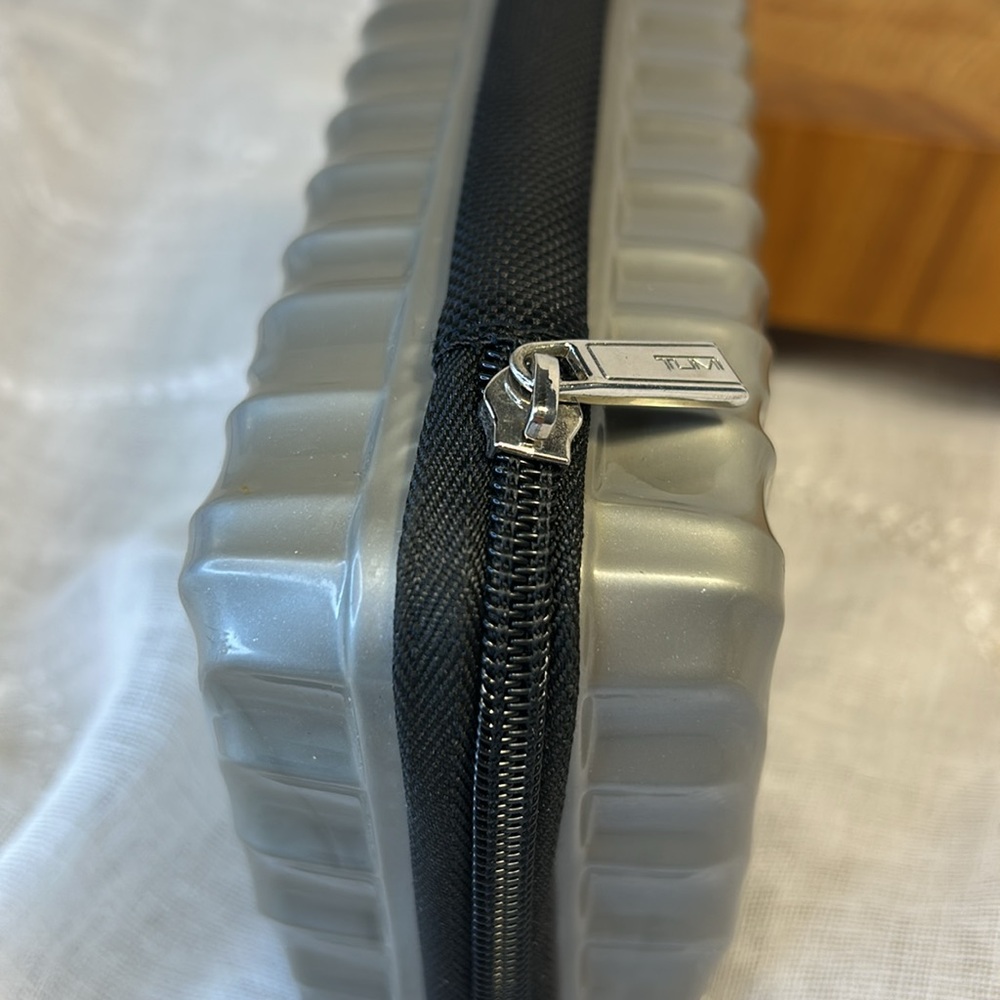 Tumi hard case luggage cosmetic bag filled with goodies for your next trip - Picture 8 of 10